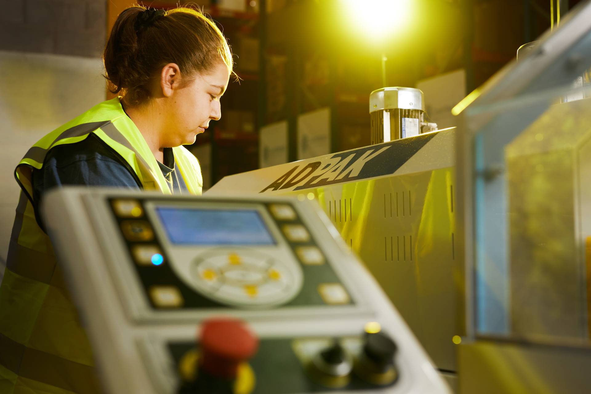 Worker using a production machine